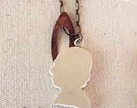 China mans head necklace on brass chain