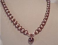 Pearl necklace with burgundy beads